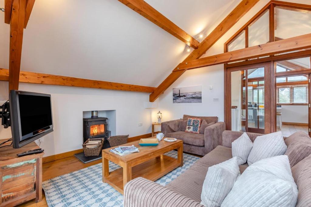 a living room with a couch and a tv at 3 Bed in Croyde oc-t30753 in Croyde