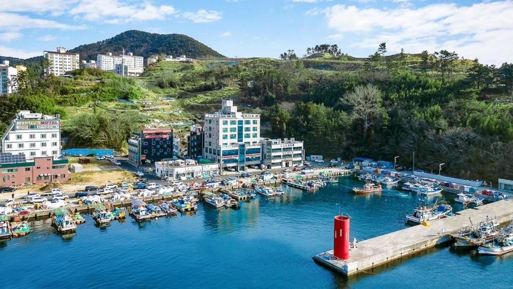 an aerial view of a harbor with boats in the water at Geoje Queen Motel in Geoje