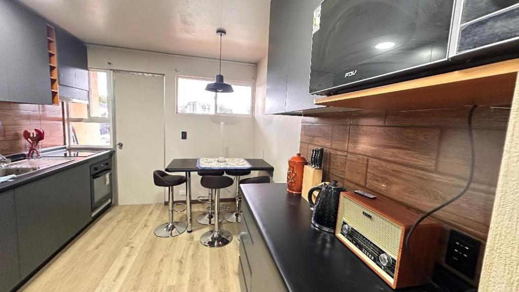 Nhà bếp/bếp nhỏ tại Departamento Pleno Centro Puerto Varas