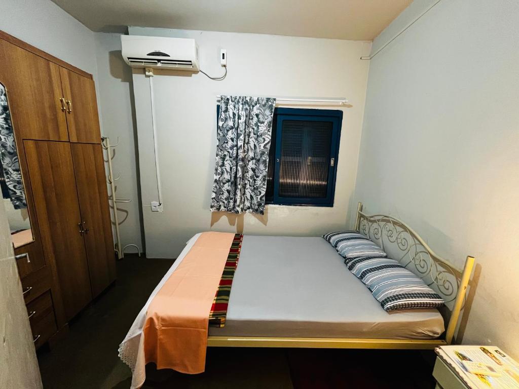 En eller flere senge i et værelse på Pousada Papirella