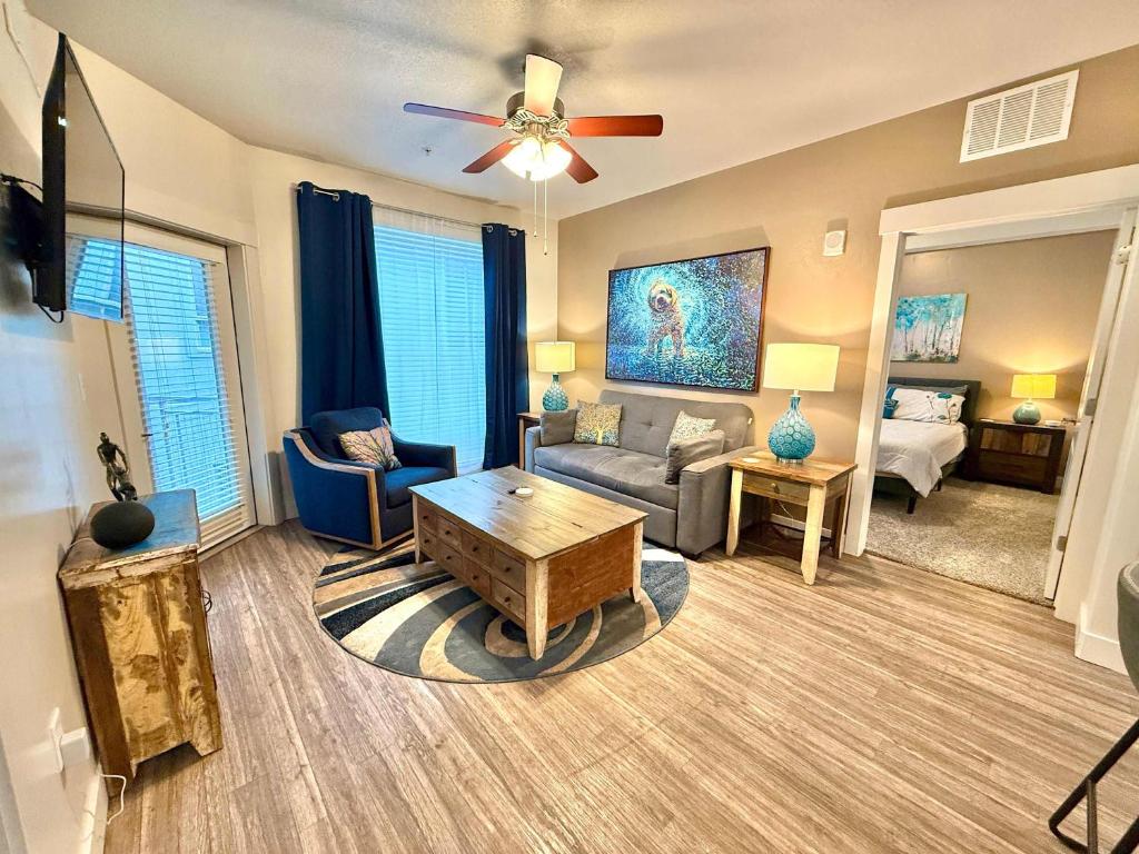 a living room with a couch and a table at Spacious 2-Bedroom Urban Oasis in Salt Lake City