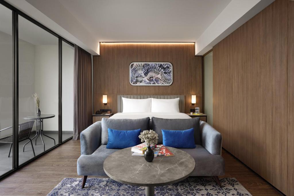 Ένα ή περισσότερα κρεβάτια σε δωμάτιο στο Oakwood Yogyakarta