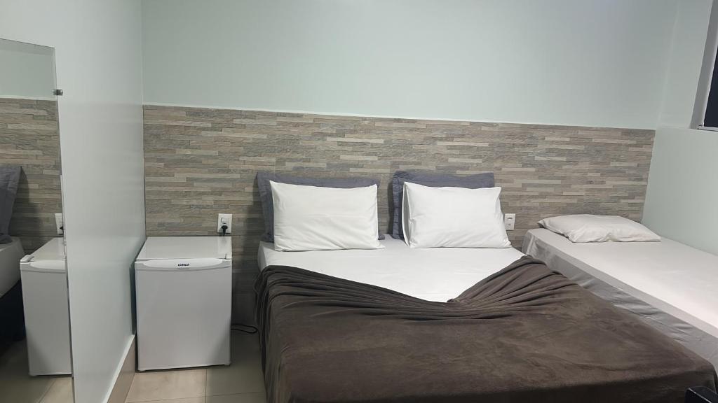 En eller flere senge i et værelse på POUSADA DA MAGA