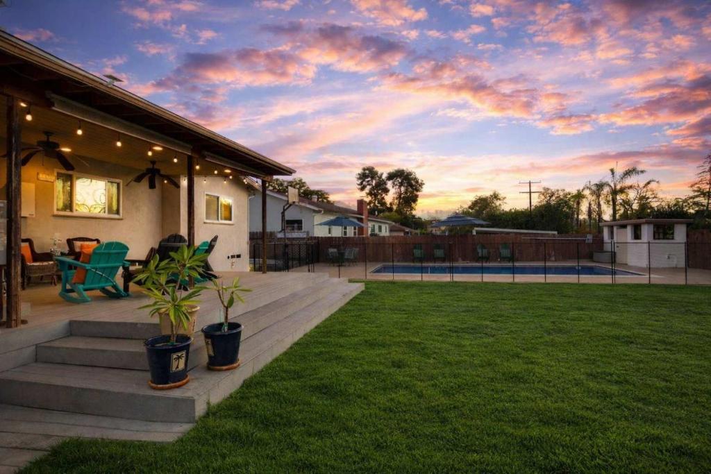 a house with a backyard with a tennis court at Pool Oasis Central Villa in El Cajon