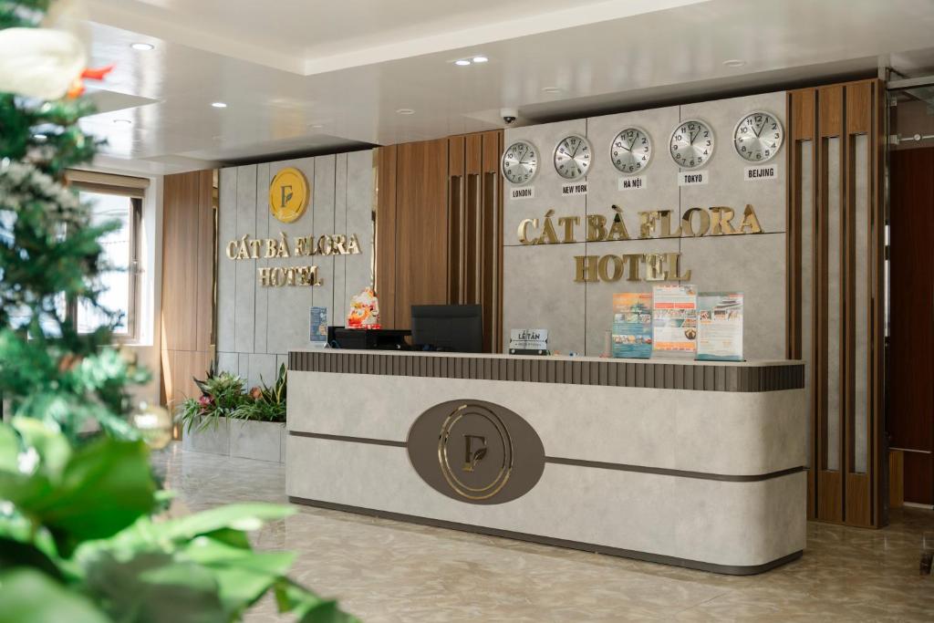 a lobby of a hotel with a reception desk at Cat Ba Flora Hotel in Cat Ba