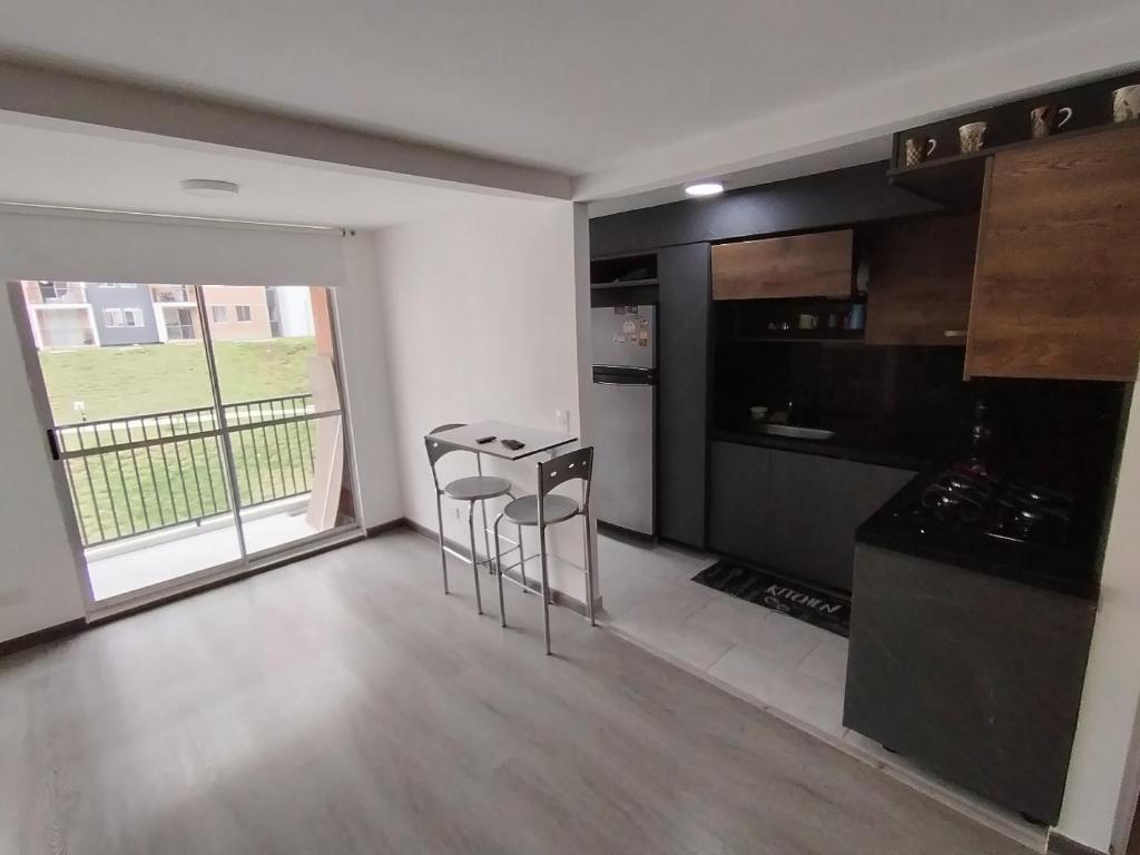 Kuchyň nebo kuchyňský kout v ubytování Confortable Apartamento cerca Aeropuerto JMC unidad Cerrada