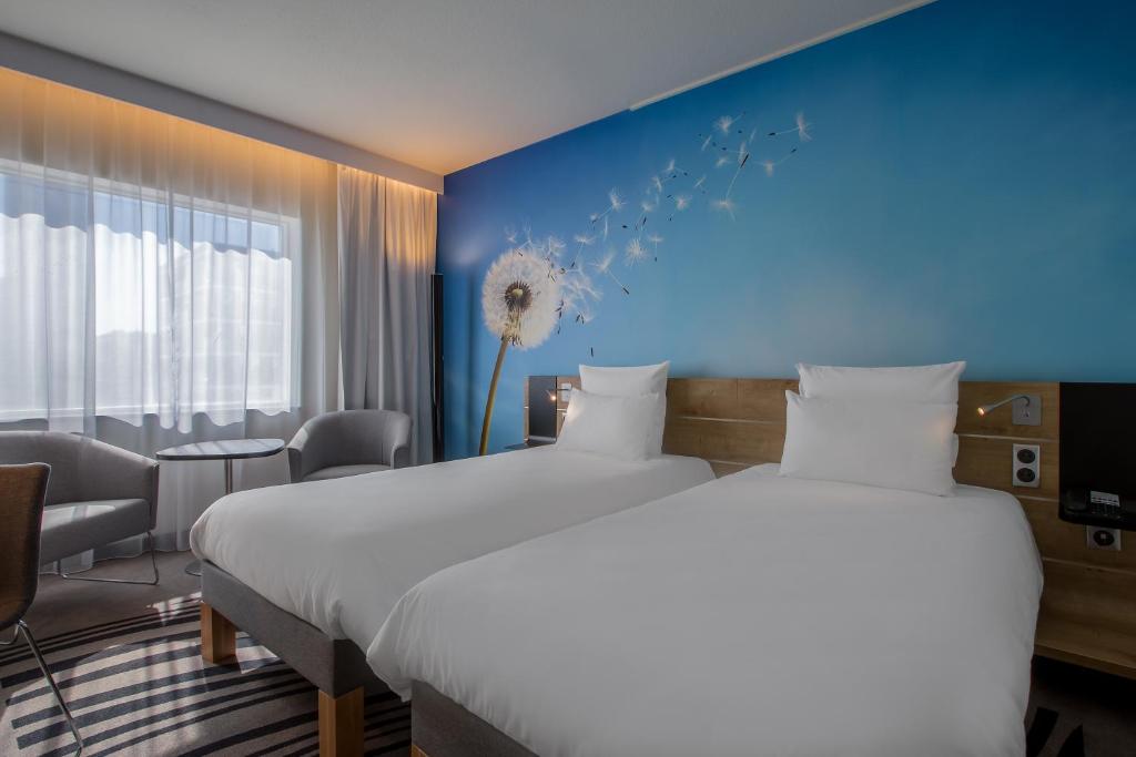 Posteľ alebo postele v izbe v ubytovaní Novotel Wrocław Centrum