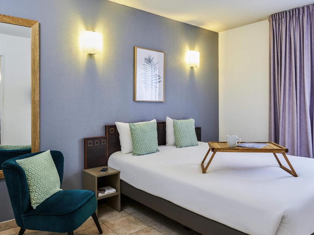 Postel nebo postele na pokoji v ubytování Aparthotel Adagio Access Nice Garibaldi