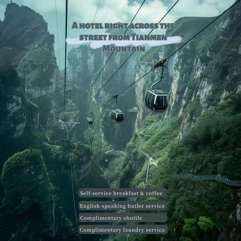a gondola ride in the sky over a mountain at The Sky Gate Hotel-Free pick-up-Free Laundry-- At the Gate of Tianmen Peak Cableway in Zhangjiajie