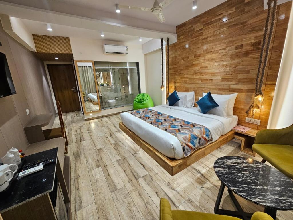 a bedroom with a large bed in a room at Travellers Hotel in New Delhi