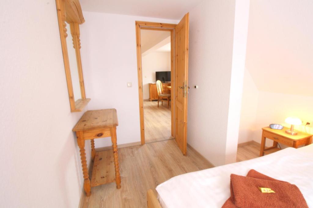 Postel nebo postele na pokoji v ubytování Hotel Brockenstübchen