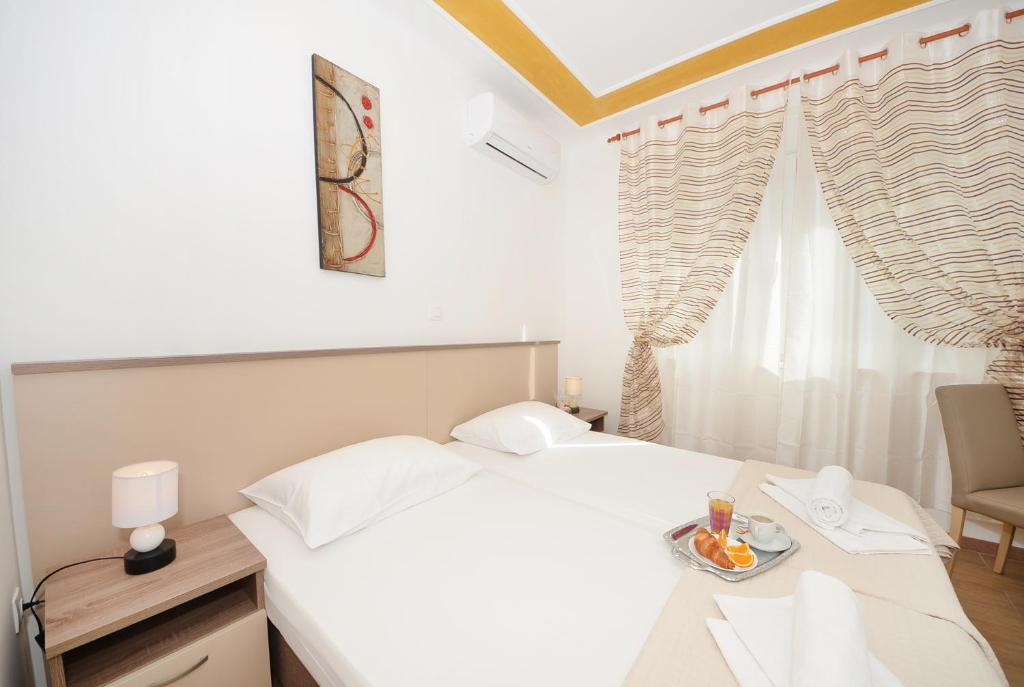 Posteľ alebo postele v izbe v ubytovaní Guest House Mia