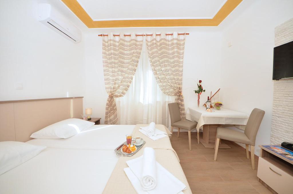 Posteľ alebo postele v izbe v ubytovaní Guest House Mia