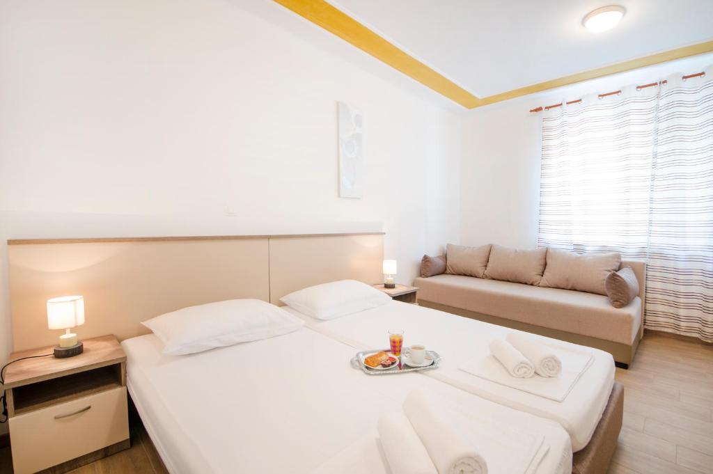 Posteľ alebo postele v izbe v ubytovaní Guest House Mia