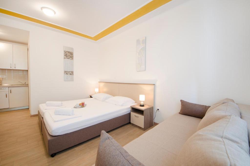 Posteľ alebo postele v izbe v ubytovaní Guest House Mia