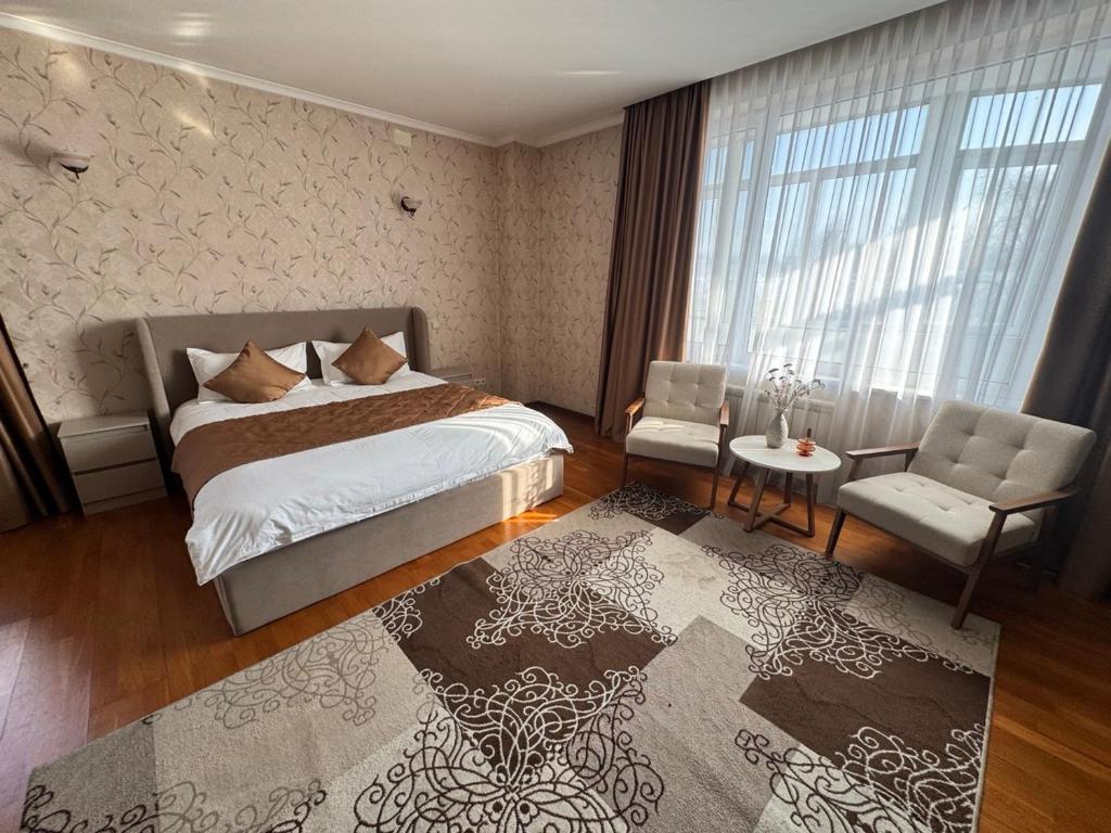 En eller flere senge i et værelse på Apart Hotel 5