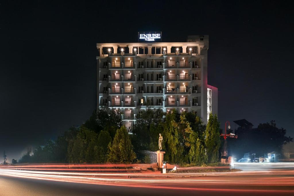 a building with a sign on top of it at night at Enrise by Sayaji, Vadodara in Vadodara