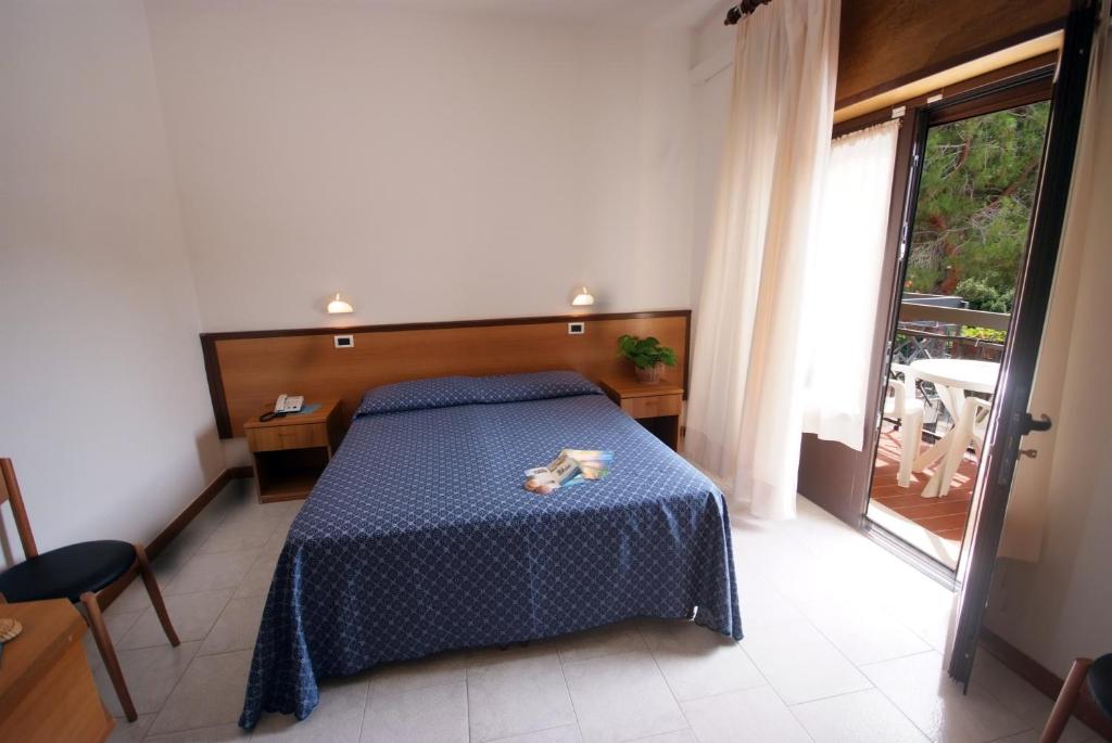 Posteľ alebo postele v izbe v ubytovaní Hotel Lilly