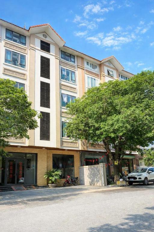 a large building with a car parked in front of it at Phương Anh Villa Pro in Bắc Ninh