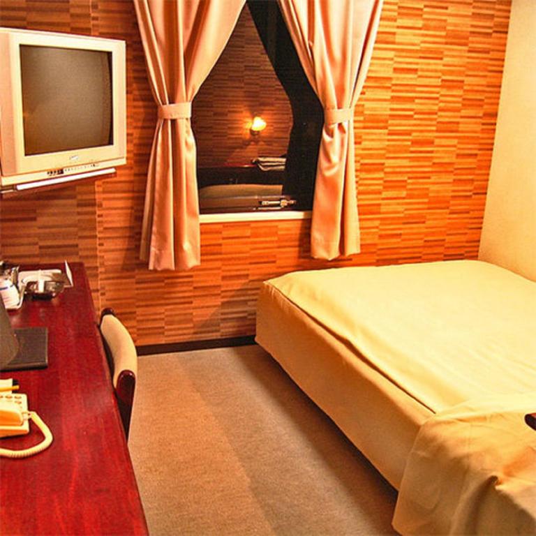 Postel nebo postele na pokoji v ubytování Hotel Tsubame Hills