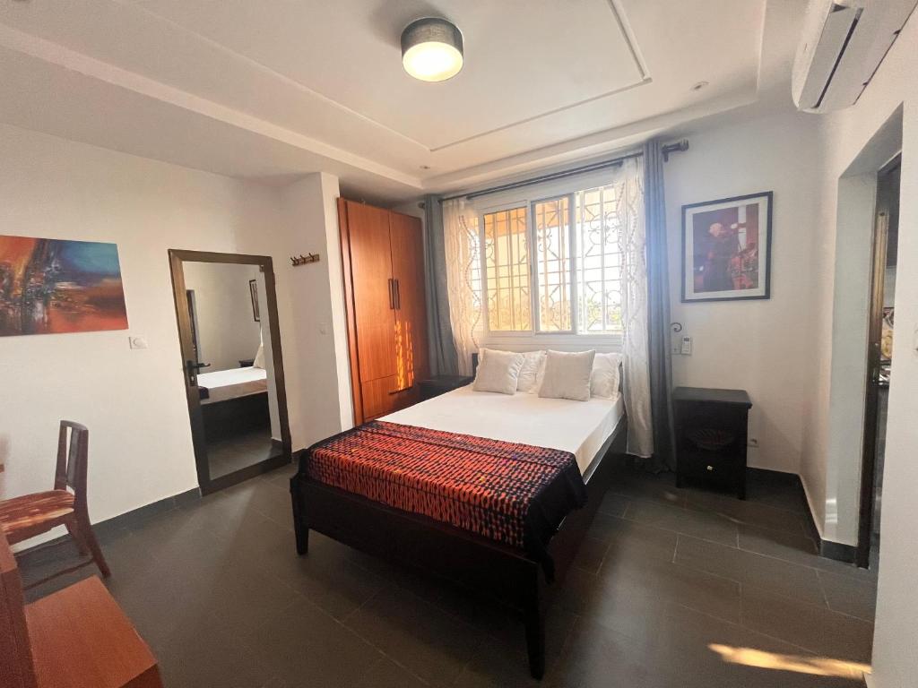 Postel nebo postele na pokoji v ubytování Appartement moderne de standing au cœur de Lomé
