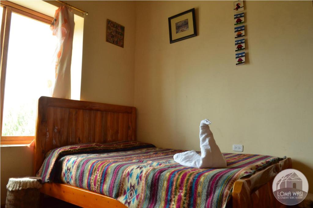 Postel nebo postele na pokoji v ubytování Casa Hotel Loma Wasi en Cotacachi