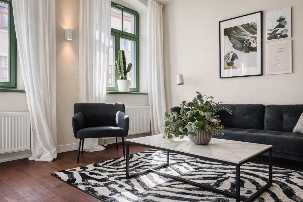 Posezení v ubytování Hip & Minimalist - Stadt Apartments am Malerweg