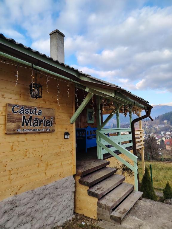 a building with a sign that reads casa marital at Casuta Mariei, Borsa,Maramures in Borşa