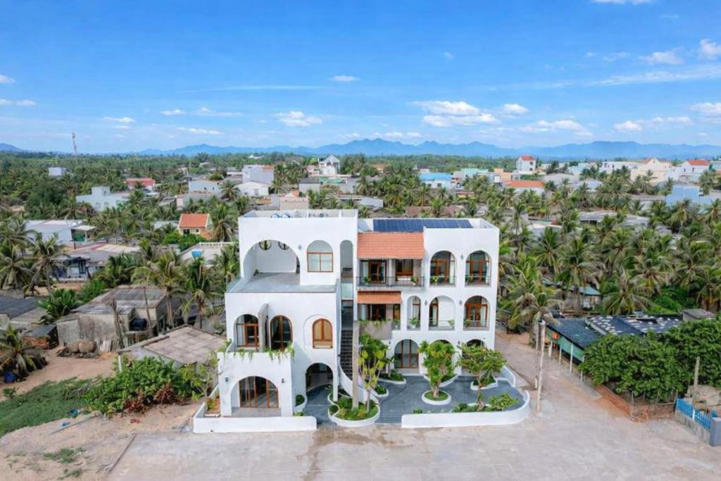 an aerial view of a large white house at HiDra Homestay in An Tịnh