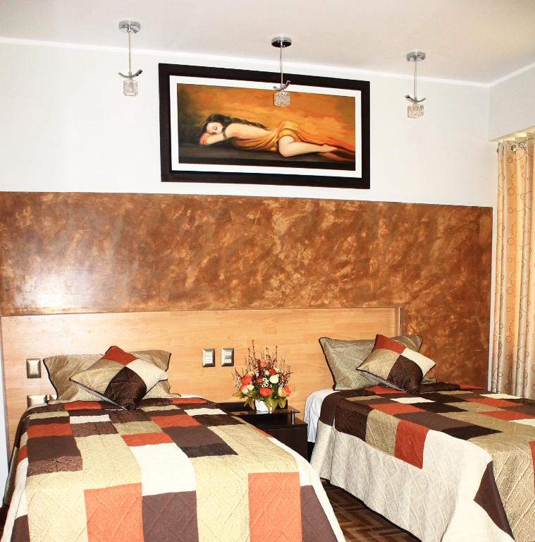 Postel nebo postele na pokoji v ubytování Hostal Gold Star