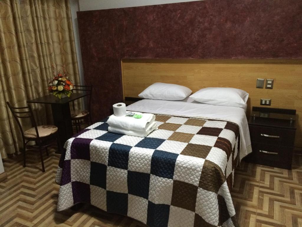 Postel nebo postele na pokoji v ubytování Hostal Gold Star