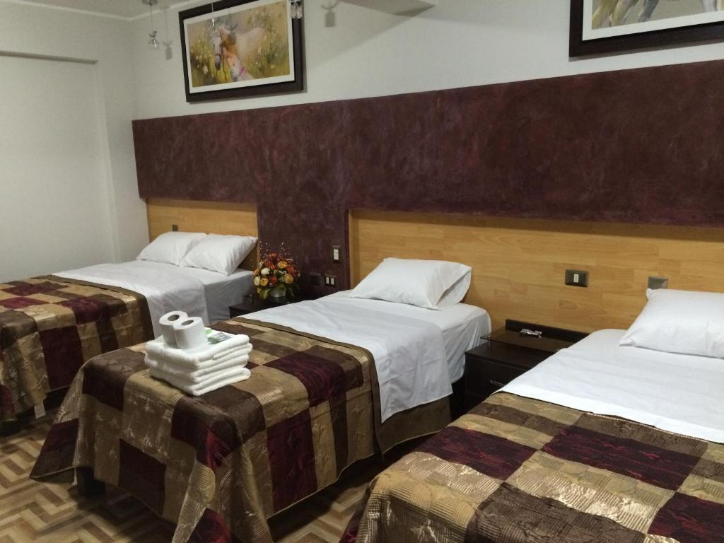 Postel nebo postele na pokoji v ubytování Hostal Gold Star