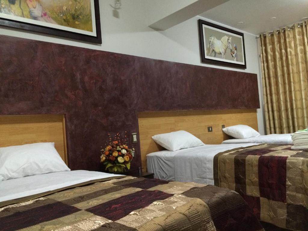 Postel nebo postele na pokoji v ubytování Hostal Gold Star