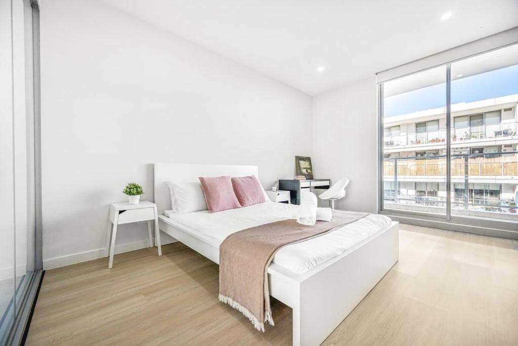 Ένα ή περισσότερα κρεβάτια σε δωμάτιο στο Tranquil Studio in Schofields