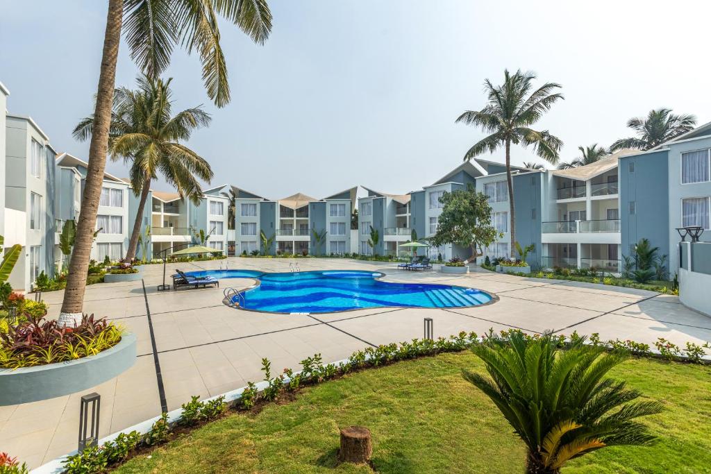 an image of the pool at the villas at embassy reef resort at Sterling Arka Suites, Puri in Puri