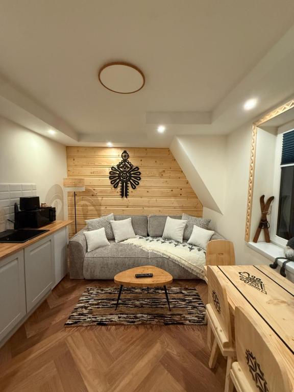 Posezení v ubytování Apartamenty Premium Biały Dunajec , Jacuzzi , Sauna, Darmowy parking, Kominki w apartamentach, Widok na góry