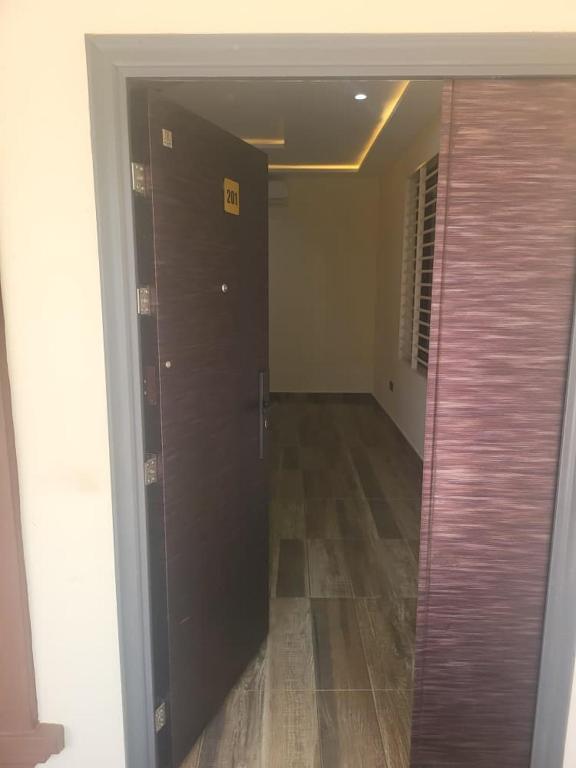 a hallway with a sliding door in a building at Property for rent in Accra