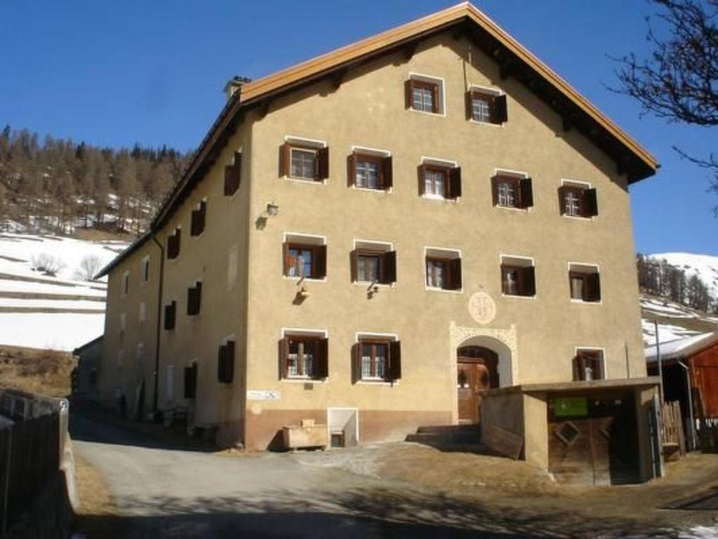 a large building with a lot of windows at Apartment Davo Tuoi by Interhome in Guarda