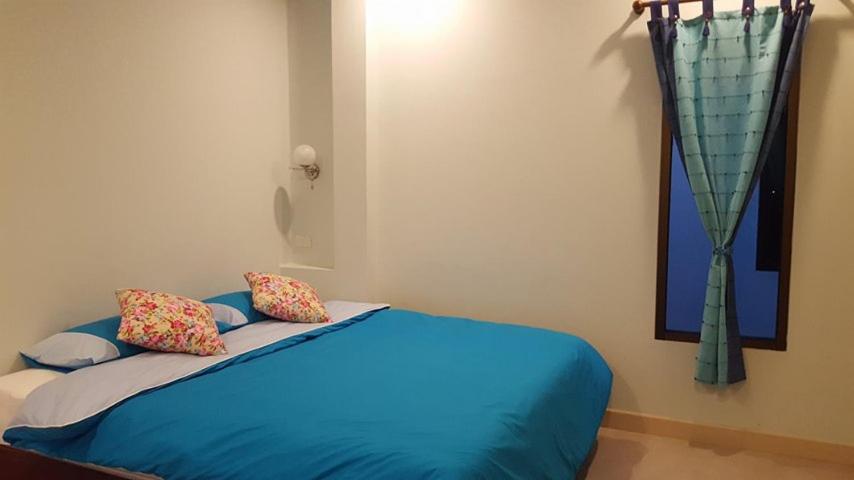 Letto o letti in una camera di The House at Pranburi