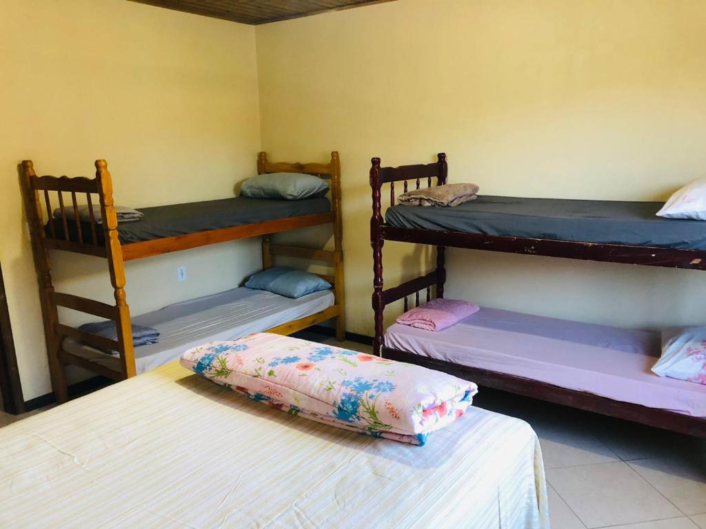 En eller flere senge i et værelse på Pousada Mizuyama