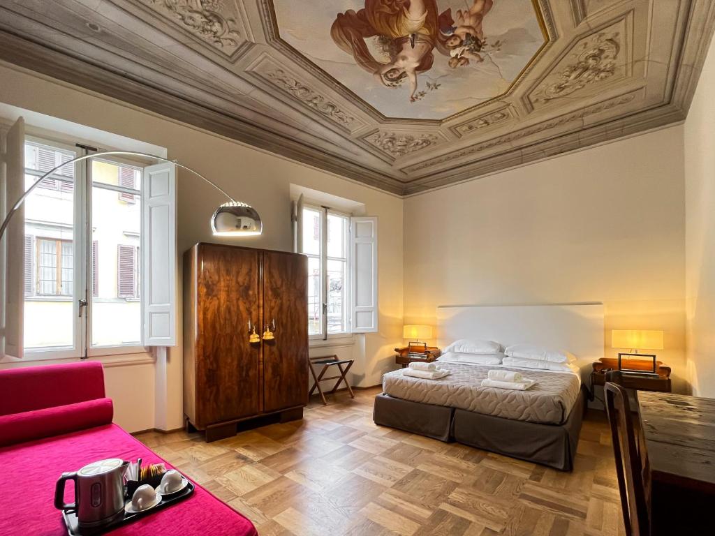 Кровать или кровати в номере Hotel la Scala