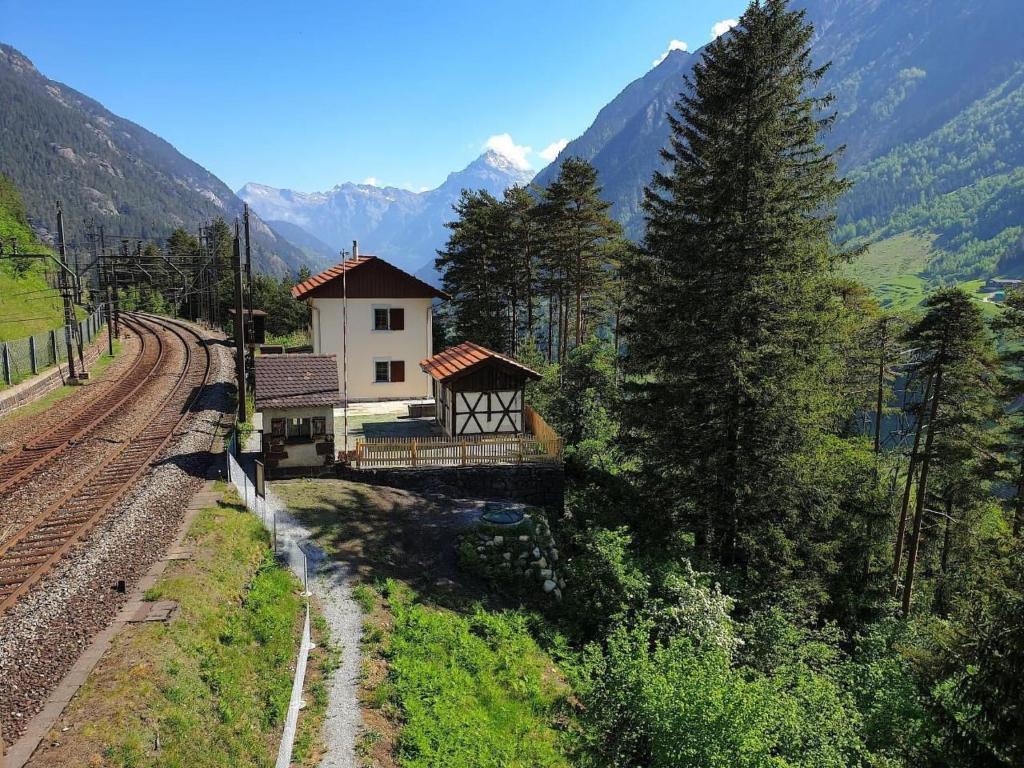 a small building on a bridge over a train track at Holiday Home Eggwald by Interhome in Wassen