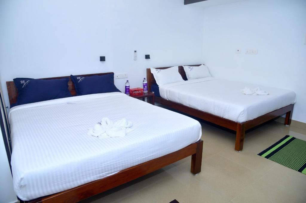 Postel nebo postele na pokoji v ubytování Cardiff palace