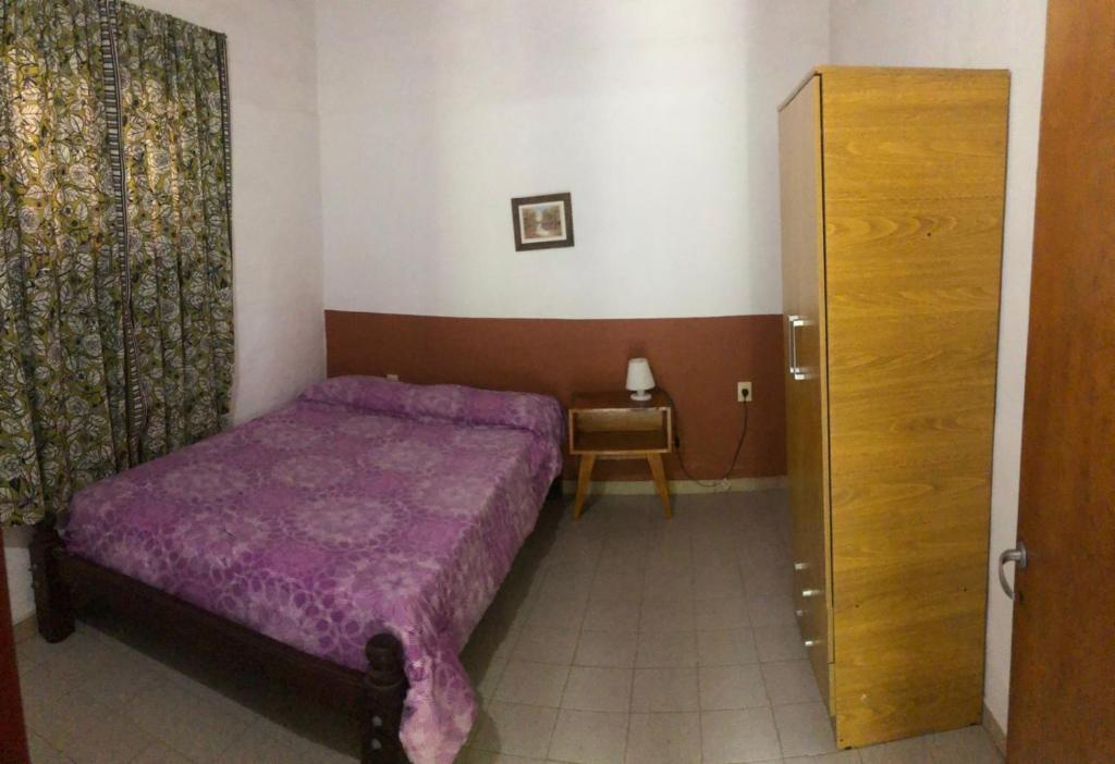 En eller flere senge i et værelse på Los Nidos Dormis Habitaciones con baño privado y DEPARTAMENTOS