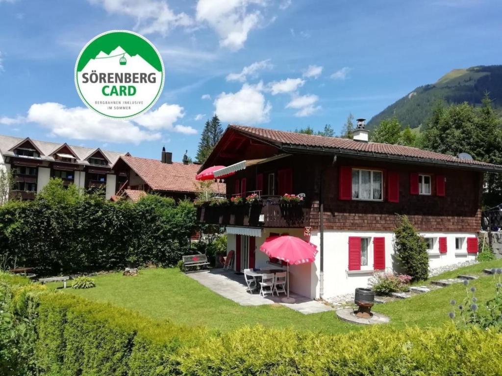 a house with a sign that reads somewhere card at Apartment Bella Vista by Interhome in Sörenberg