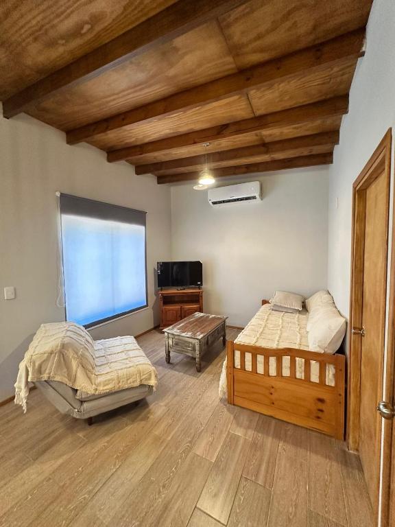 a room with two beds and a tv in it at Refugio del Mar 2 in Ocean Park