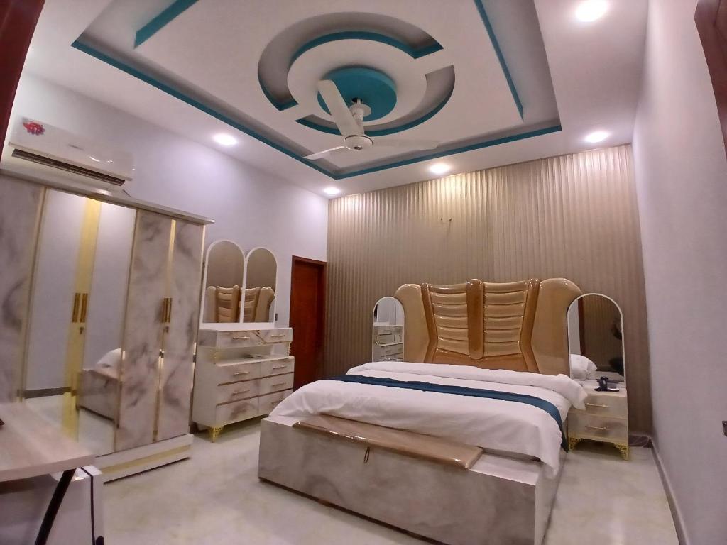 a hospital room with a bed and a mirror at Prime Star Hotel in Karachi