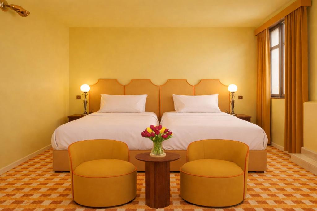 Postel nebo postele na pokoji v ubytování Latroupe Hotel Le Berger