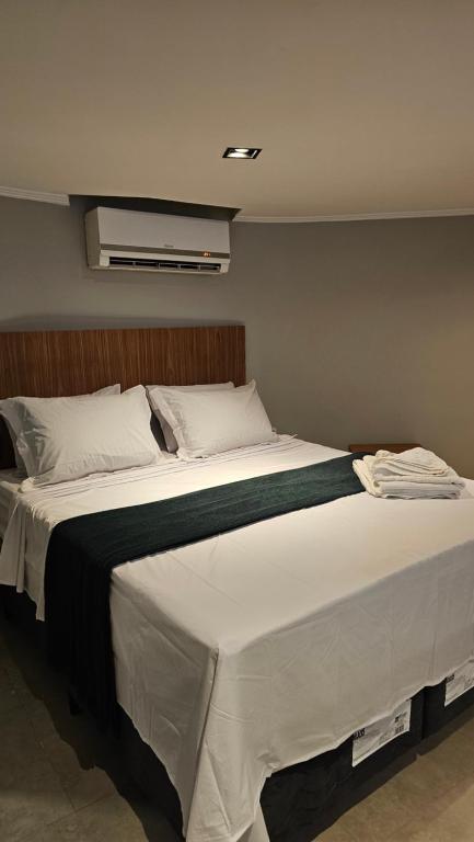 En eller flere senge i et værelse på Chalés Feliz Boipeba