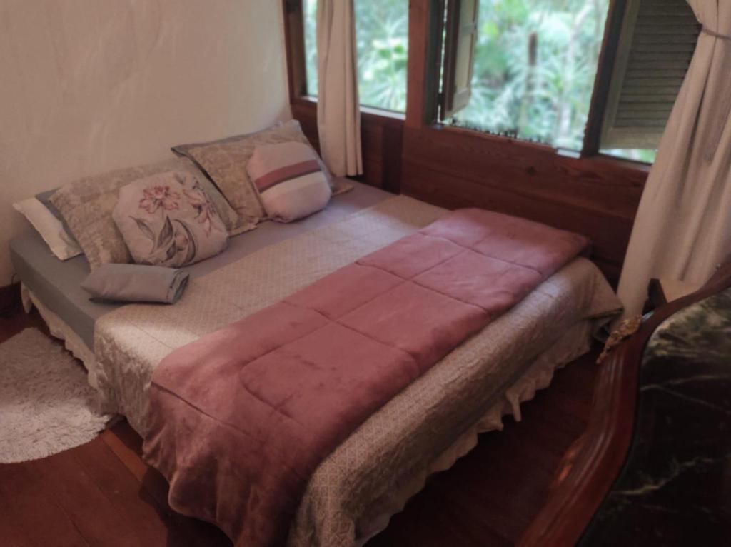 En eller flere senge i et værelse på Cabana da Pedra para Casal